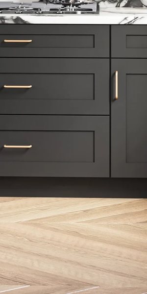 A kitchen with Woodbourne cabinets in Black